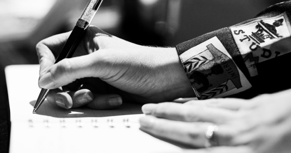 Close-up of hand holding a pen