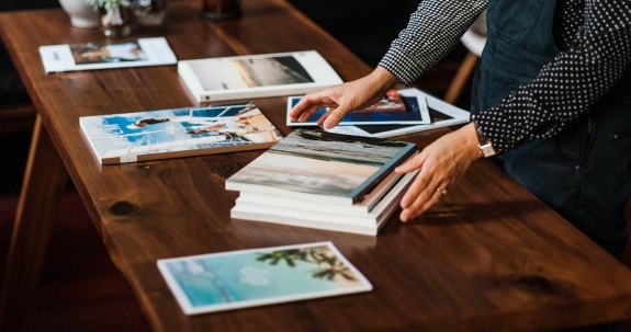 Person organising magazines on a desk